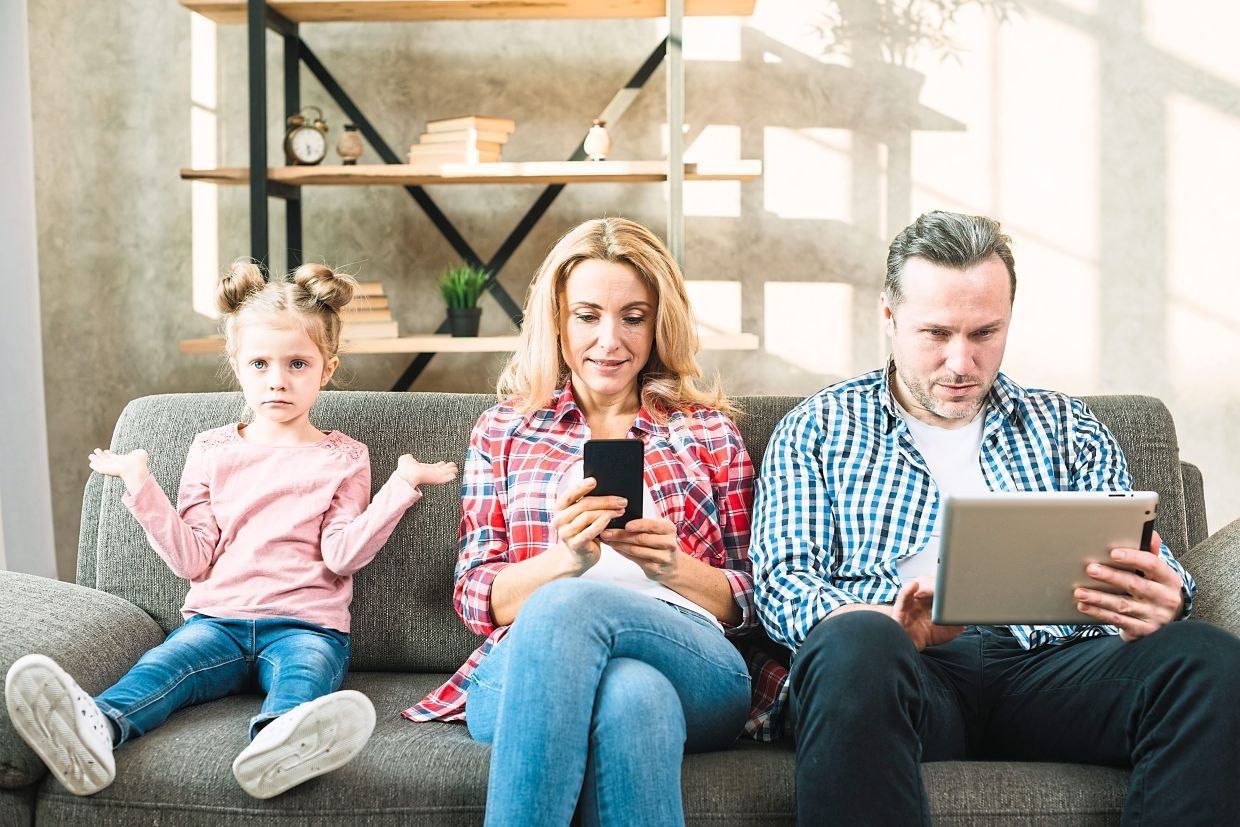 Want to reduce your kid's screen time? Start with yourself first