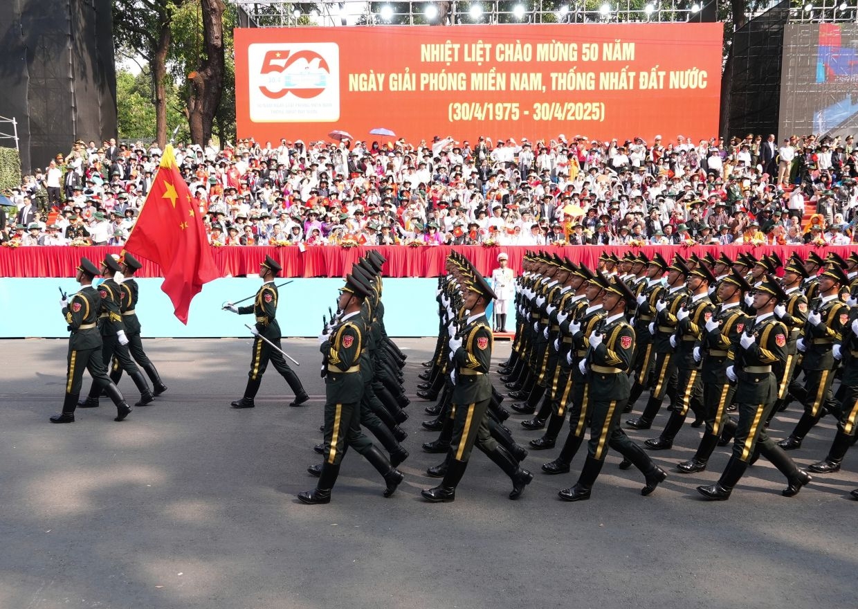 Lao President attends historic 50th reunification anniversary of Vietnam
