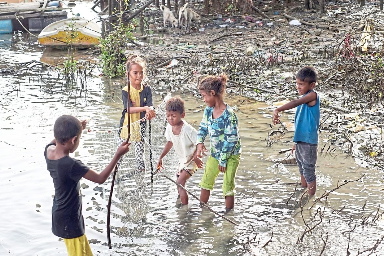 Orang Asli kids skip school to earn money