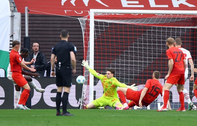 Soccer-Bayern keeper Urbig eyes another title after winning Bundesliga