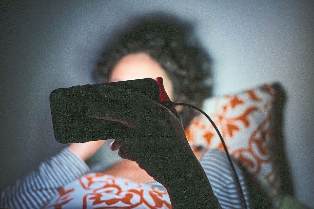 Scrolling on your phone in bed can ruin your sleep, study says