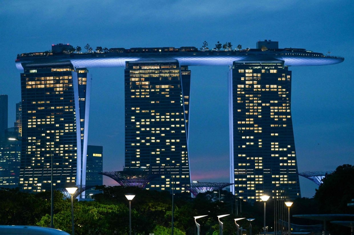 Singapore says its growth forecast may need further adjustment amid uncertainty