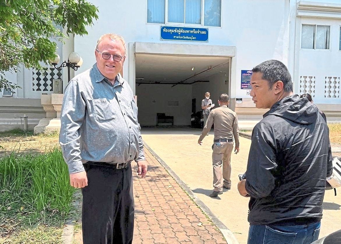 Scholar freed but not free to go