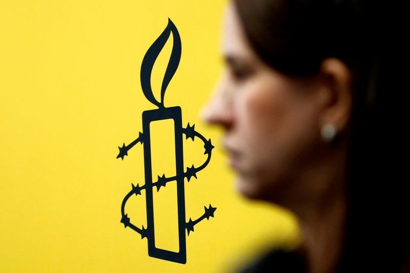 Russia bans Amnesty International, which vows to redouble work on rights abuses