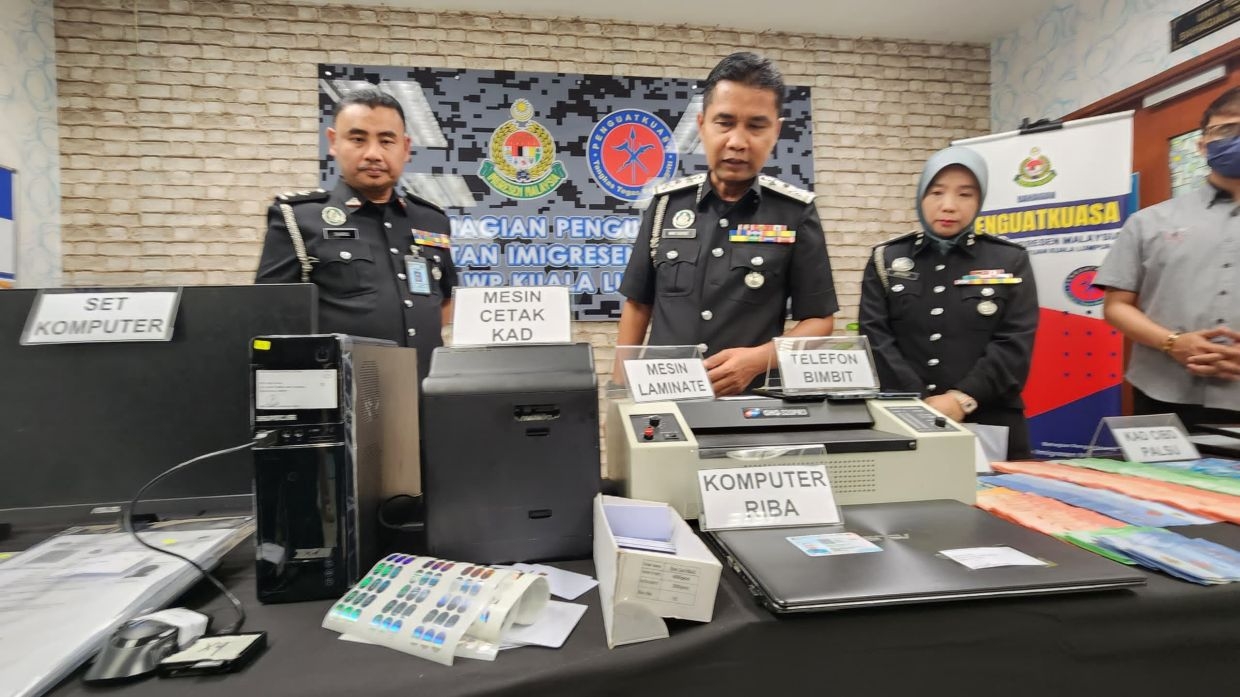 Father and son busted for forging Immigration cards and passes