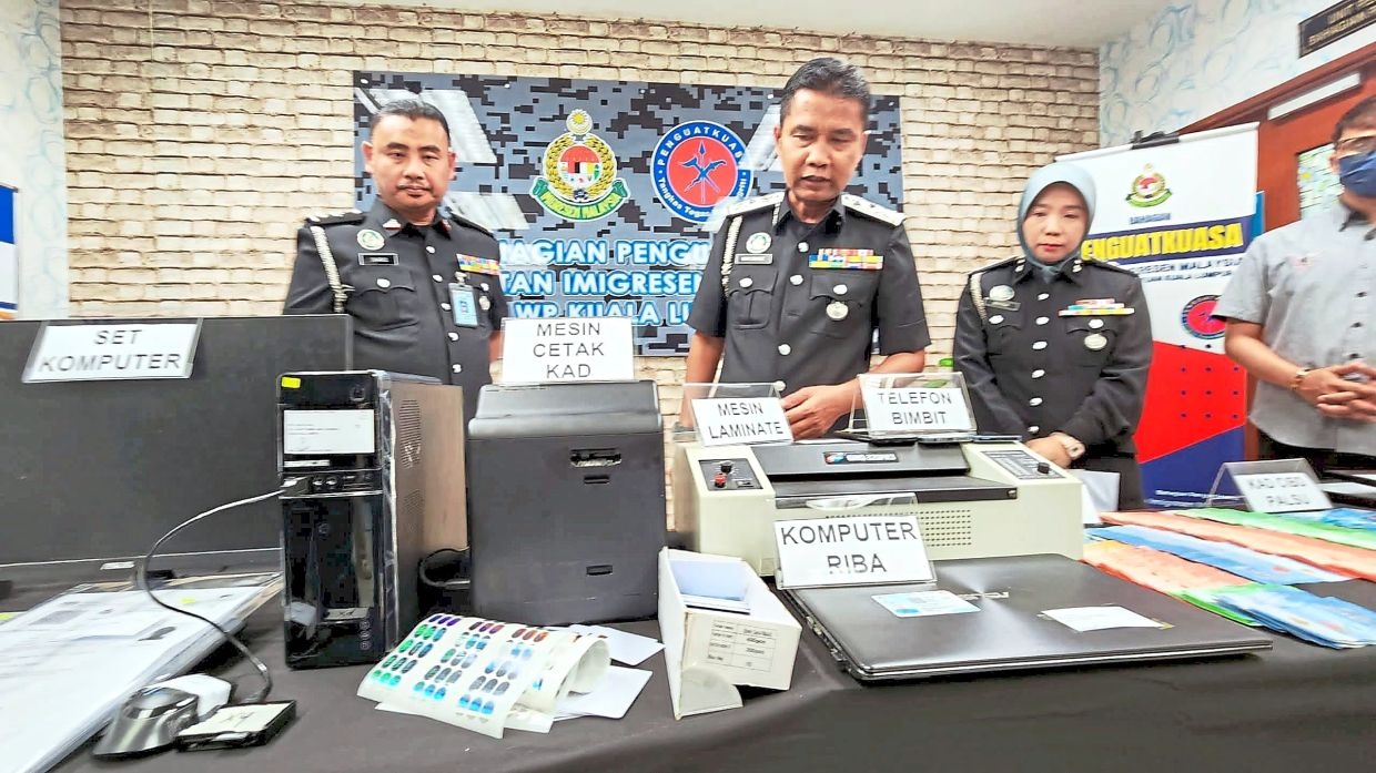 Father, son nabbed over fake ID shop