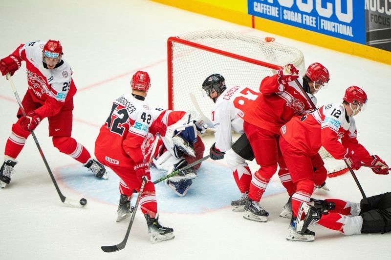 Ice hockey-Denmark stun Canada, Swedes beat Czechs to reach world championship semis