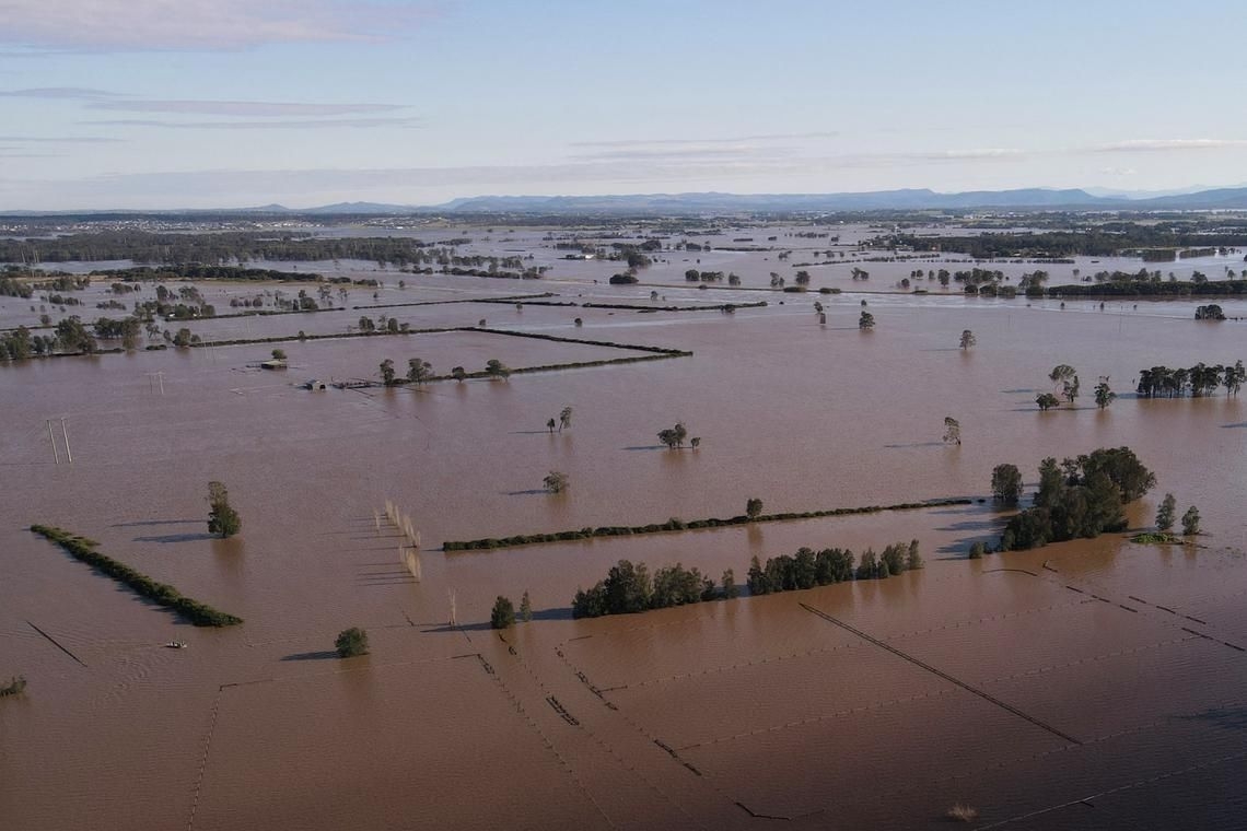 Australia begins clean-up after floods kill five, damage 10,000 properties