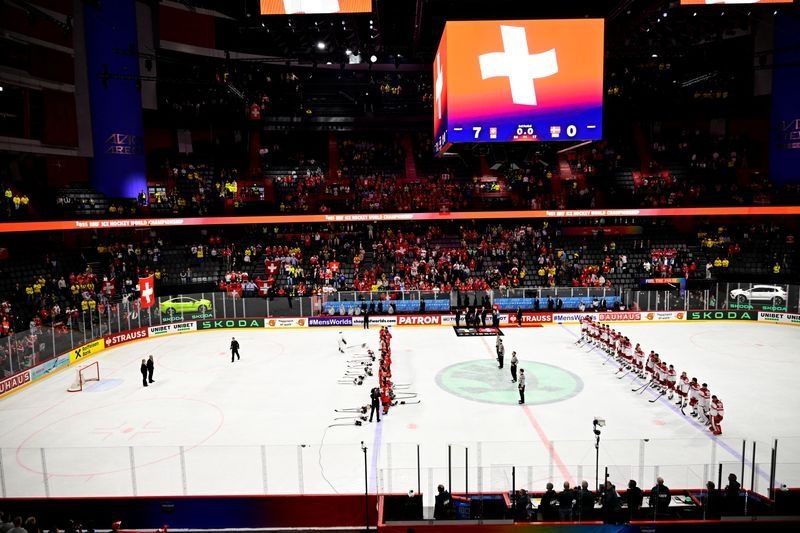 Ice hockey-Swiss end Denmark fairytale 7-0 to reach world championship final
