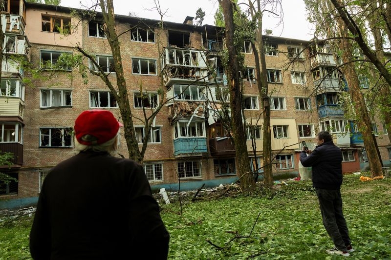 Russian drone fragments set Kyiv apartment building ablaze, official says