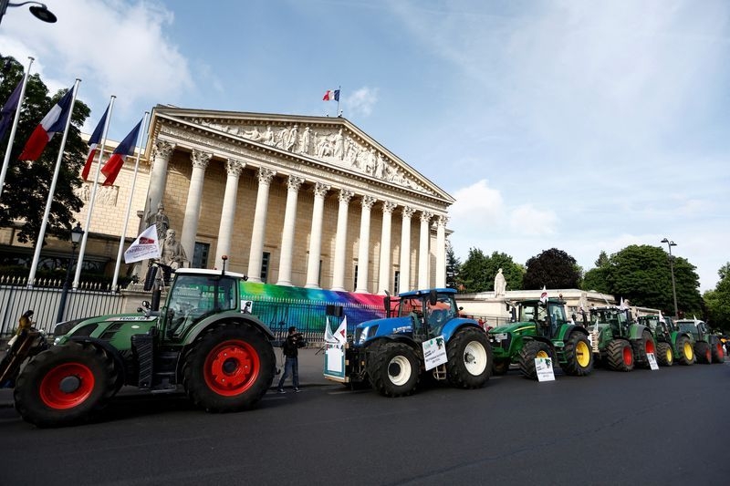 French farmers bring tractors to Paris to press for looser rules