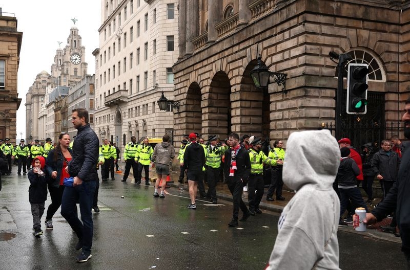 Man detained after car hit crowds at Liverpool's title parade