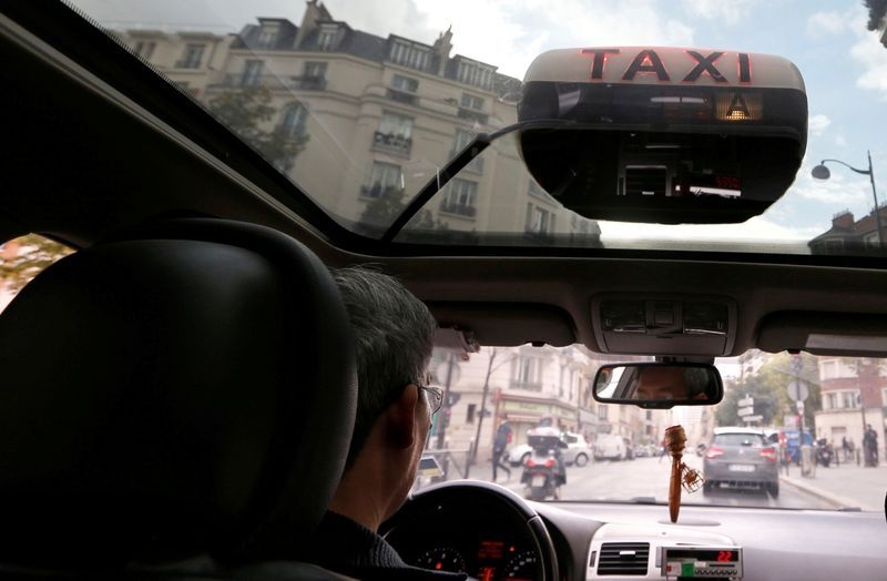 French taxi protests test PM's budget-cutting resolve