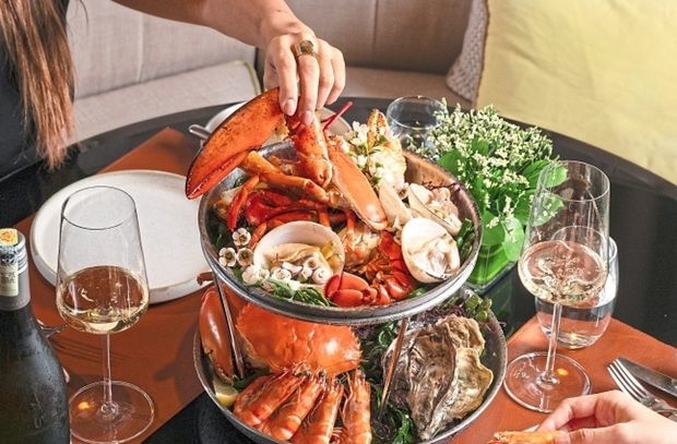 Immersive Sunday dinner of seafood, tableside theatre experience