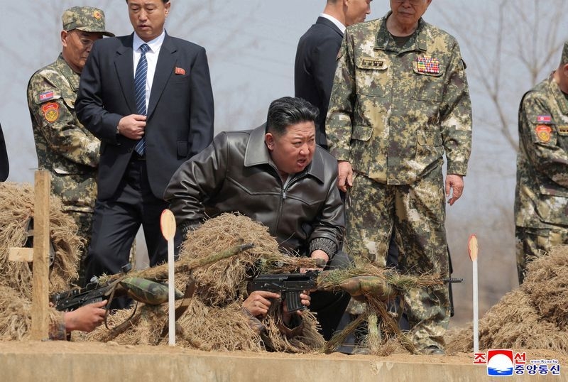 North Korea's Kim Jong Un leads meeting on strengthening military, inspects artillery drill