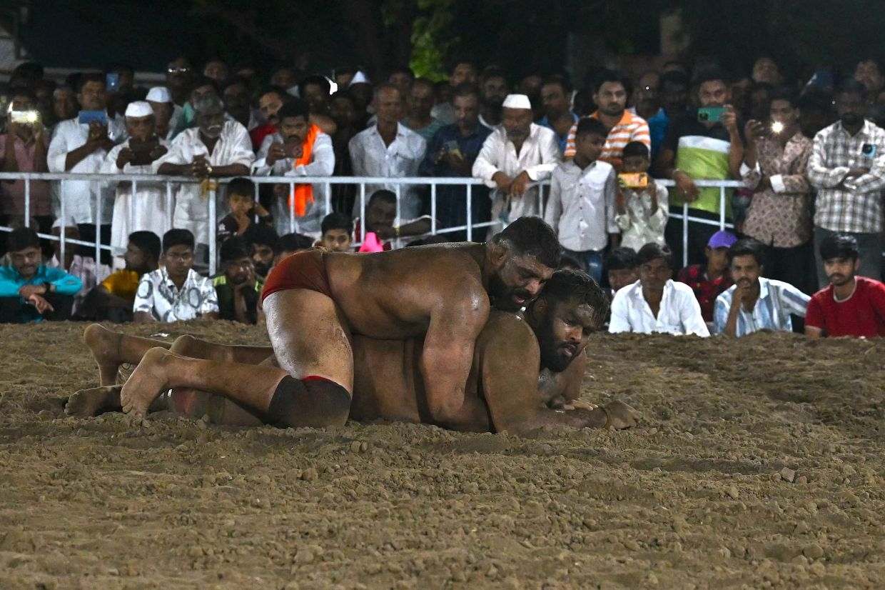 Rooted in the earth, Indian traditional mud wrestling thrives