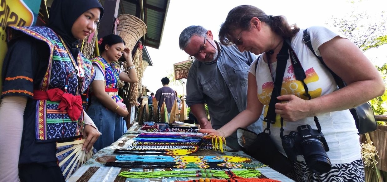 Foreign visitors capture the heart of Kaamatan through their lens