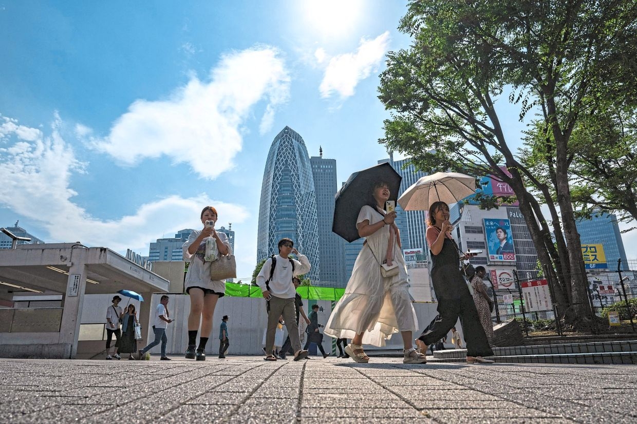 Protect workers from heat waves or face fines, Japan tells firms