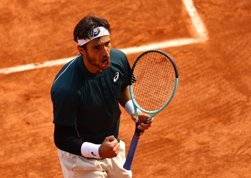 Tennis-Maestro Musetti carves Tiafoe win to reach French Open semi-finals