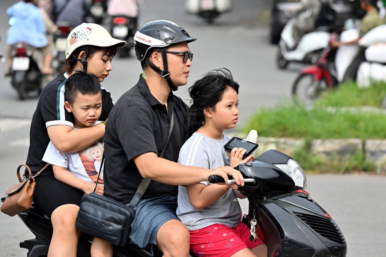 Vietnam ends two-child policy as birth rate hits record low