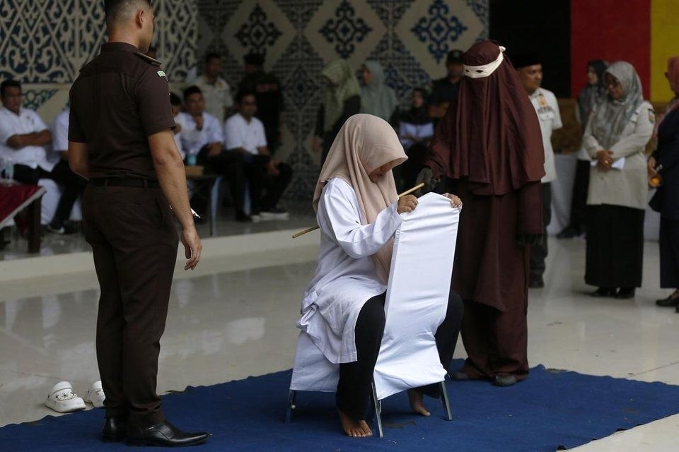 Couple publicly flogged in Indonesia for sex outside marriage
