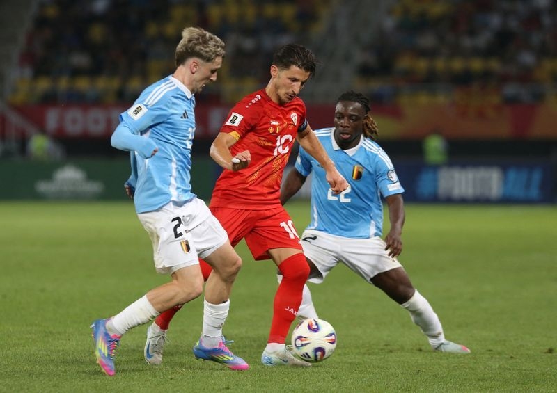 Soccer-Belgium coach shows faith in shaky defence