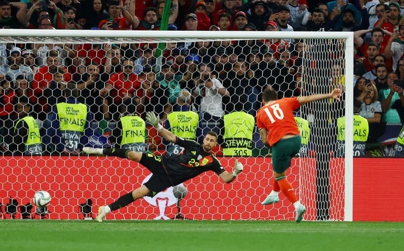 Soccer-Portugal win second Nations League title after shootout success over Spain