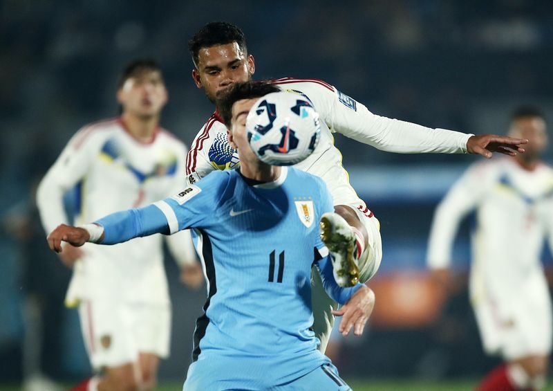 Soccer-Uruguay near World Cup qualification with 2-0 win over Venezuela