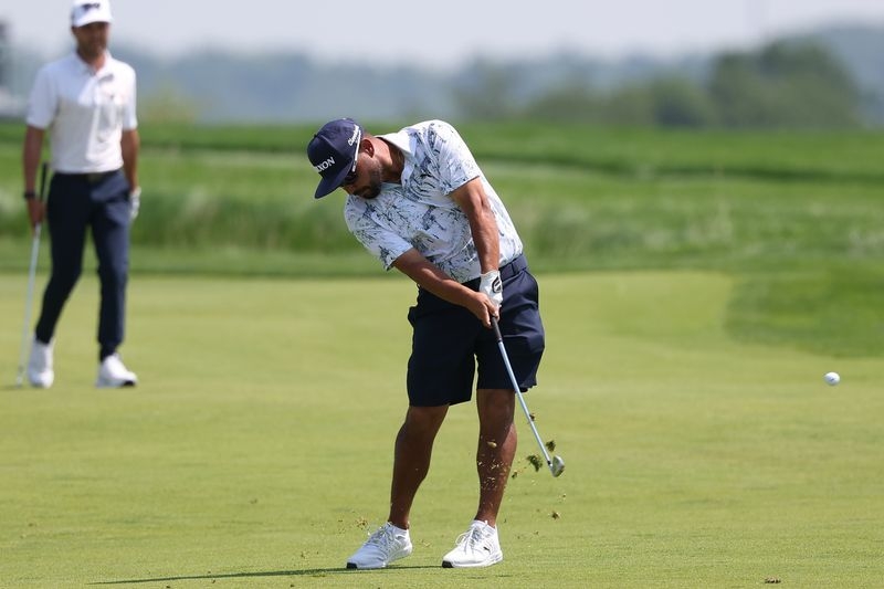 Golf-Walking on egg shells pays off for US Open leader Spaun
