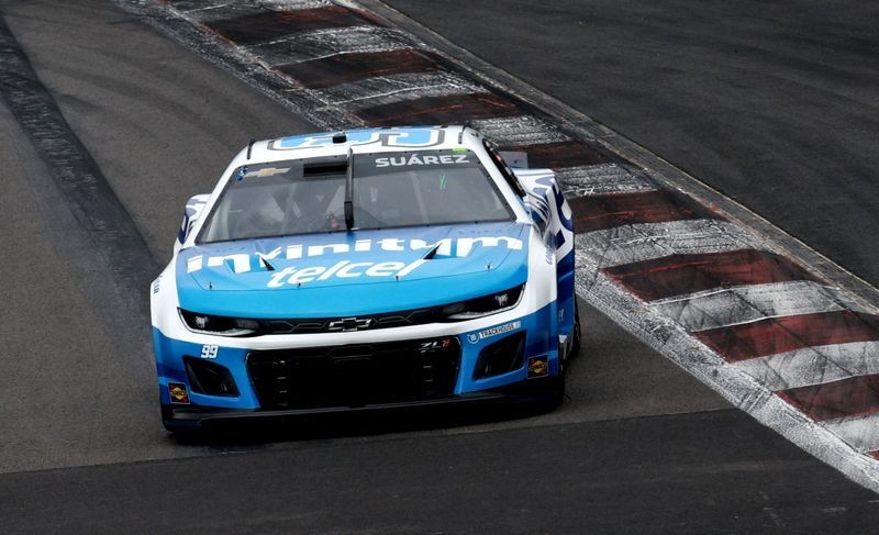 Motor racing-Mexican hero Suarez triumphs in rain-soaked NASCAR homecoming