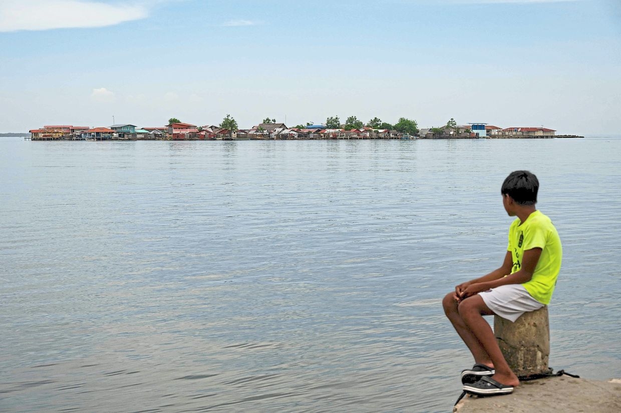 'No children left playing': Silence fills Panama island threatened by the sea