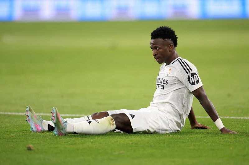 Soccer-Four people handed suspended jail sentences over Vinicius Jr effigy