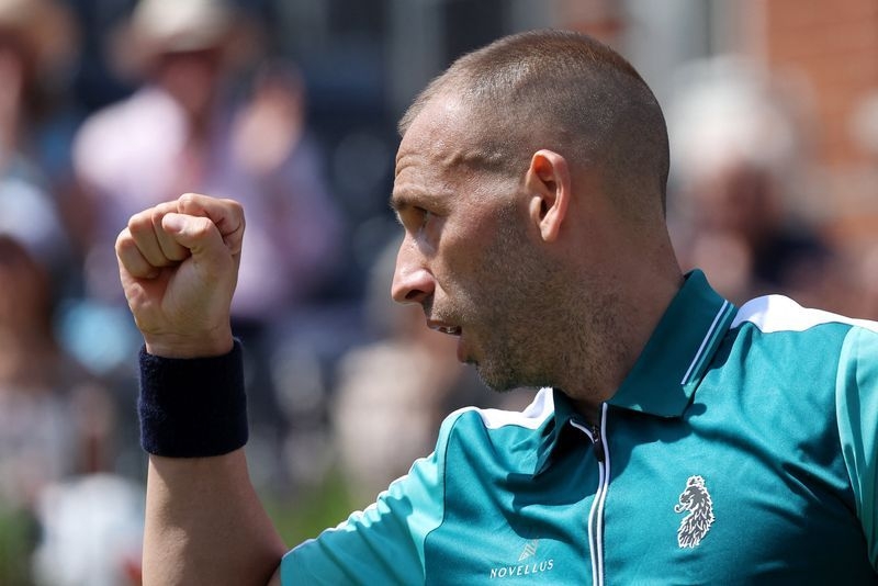 Tennis-Briton Evans stuns Tiafoe, Rune cruises into Queen's second round