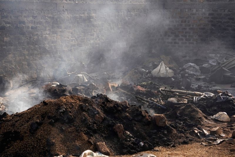 Charred bodies, shattered lives after gunmen kill 100 in Nigeria