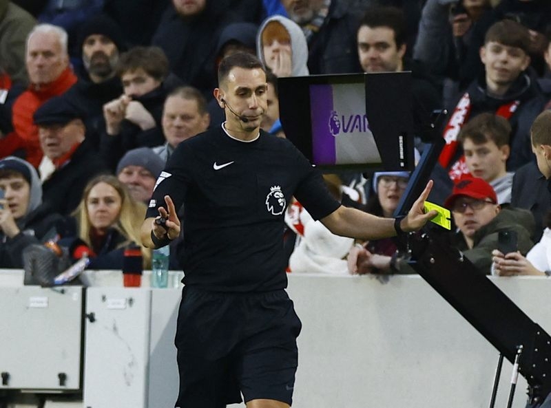 Soccer-FA charges referee Coote in relation to comments on Klopp
