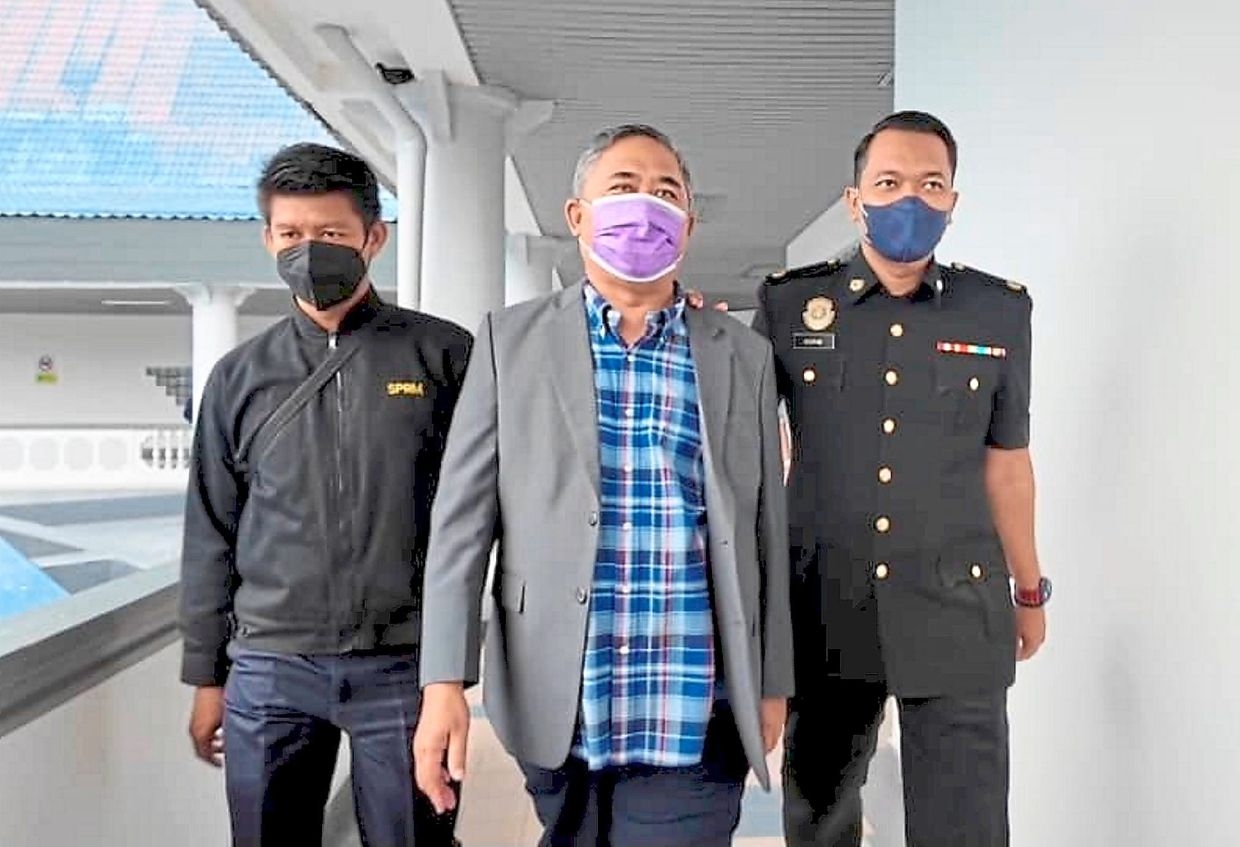 Ex-sports dept head charged with bribery and false claims