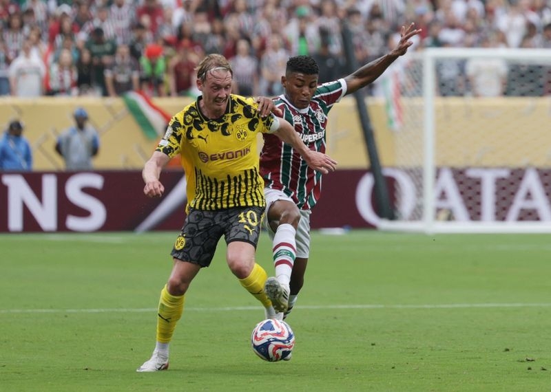 Soccer-Fluminense show Brazilian mettle in Dortmund draw