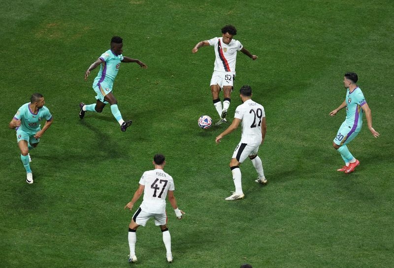 Soccer-Man City down Al-Ain 6-0 to reach Club World Cup knockout stage with Juve