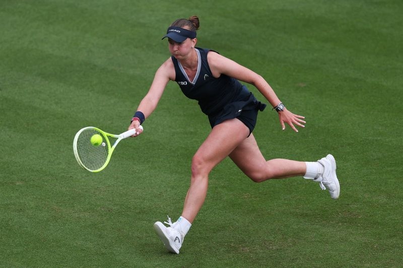 Tennis-Wimbledon champion Krejcikova snagged by broken net at Eastbourne