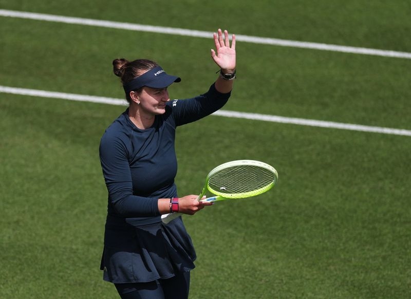 Tennis-Krejcikova saves match points again to survive in Eastbourne