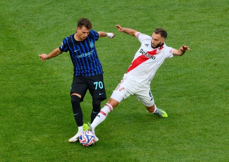 Soccer-Inter Milan strike late to progress with 2-0 win over River Plate