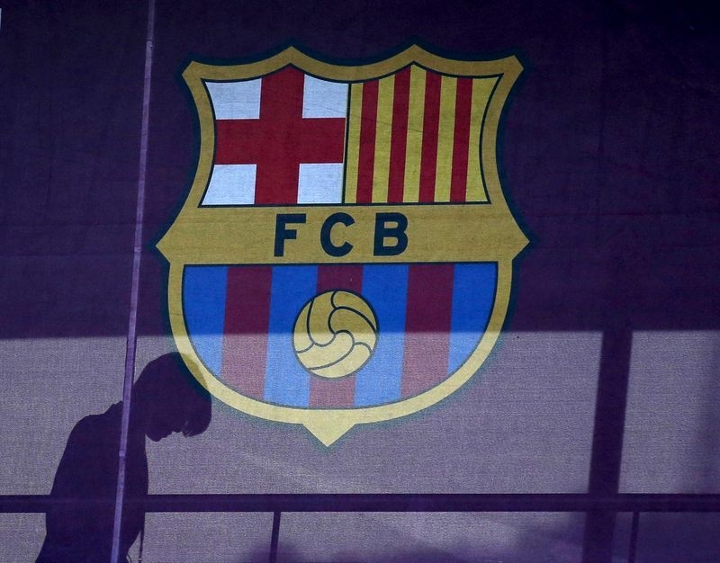 Soccer-FC Barcelona sells bonds, restructures stadium-revamp debt