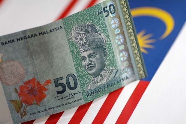 Ringgit rises to nine-month high on bond inflows, weaker dollar