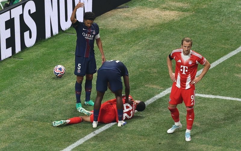 Soccer-Musiala suffers suspected broken ankle in Bayern clash with PSG