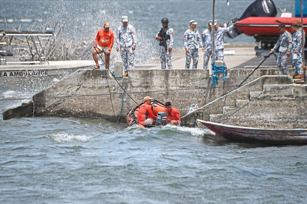 Search for missing cockfighters begins at lake in murder probe