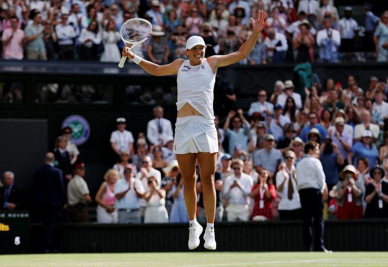 Tennis-Unforgiving Swiatek crushes Anisimova 6-0 6-0 to win maiden Wimbledon crown