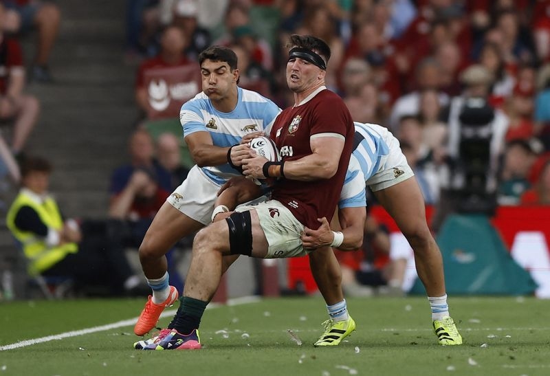 Rugby-Wales locked out of Lions as Curry named to start first test