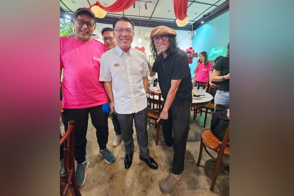 Best foot forward: Nga struts out in Malaysian-made firemen's shoes