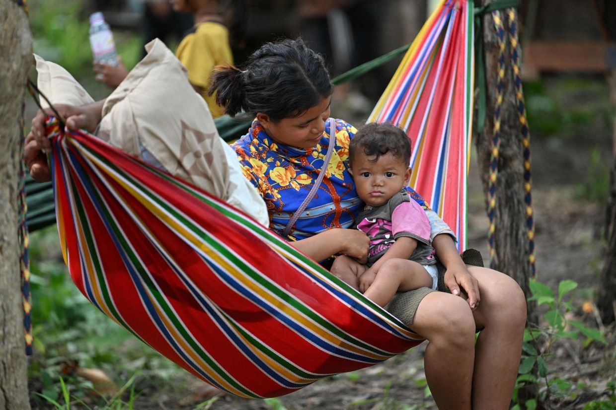 Cambodian evacuees sheltering in temple pray for end to Thai clashes