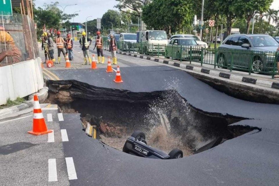 Shocker in Singapore: Woman taken to hospital after car falls into sinkhole on Tanjong Katong Road